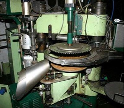 Similar Toolex Alpha record pressing machine.