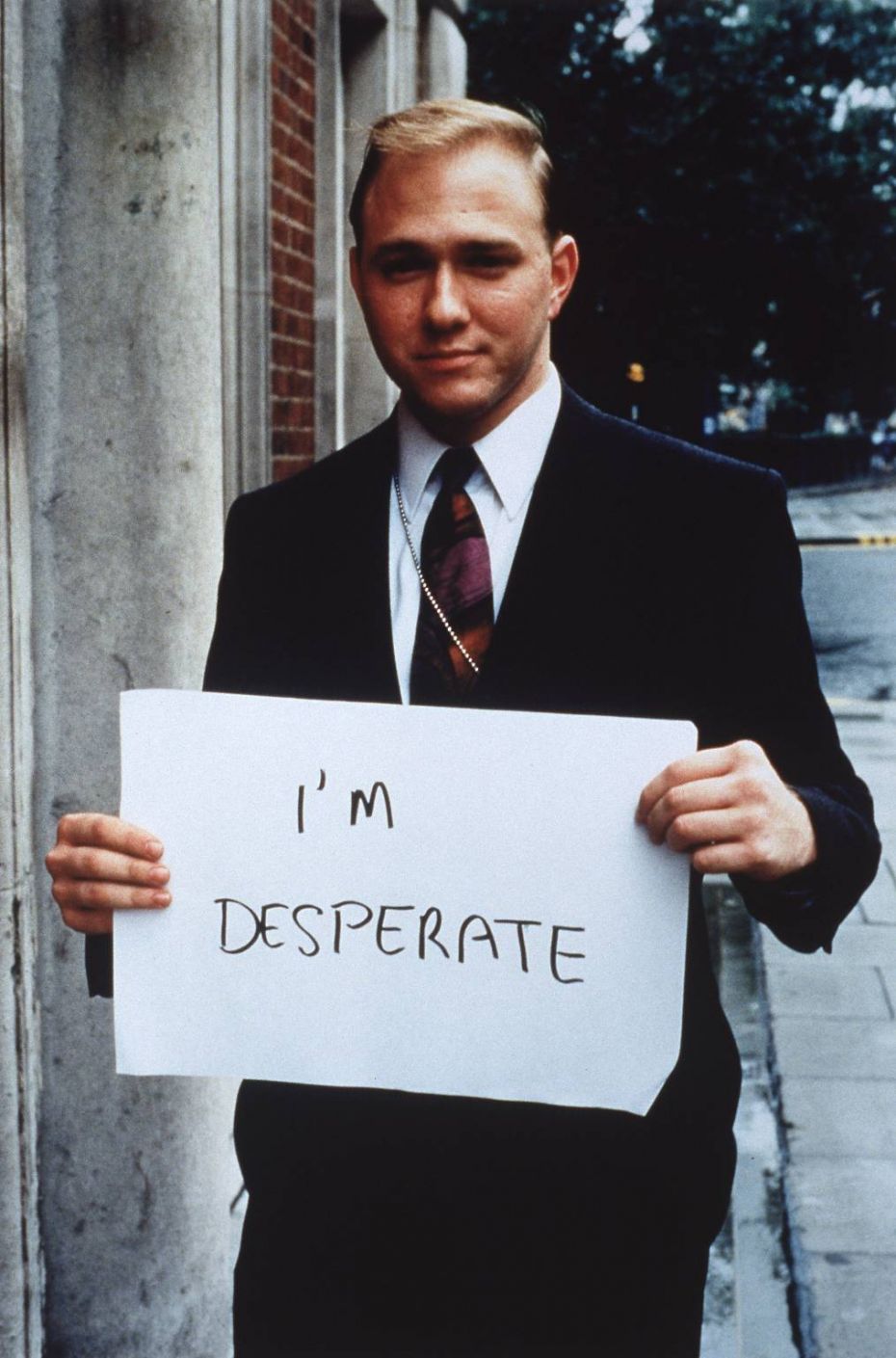 Gillian Wearing’s photograph 'I’m desperate' from a larger series of more than 50 works (1992-3, Framed color photographs on photographic paper mounted on board, Each 48 x 36 ¼ in.)