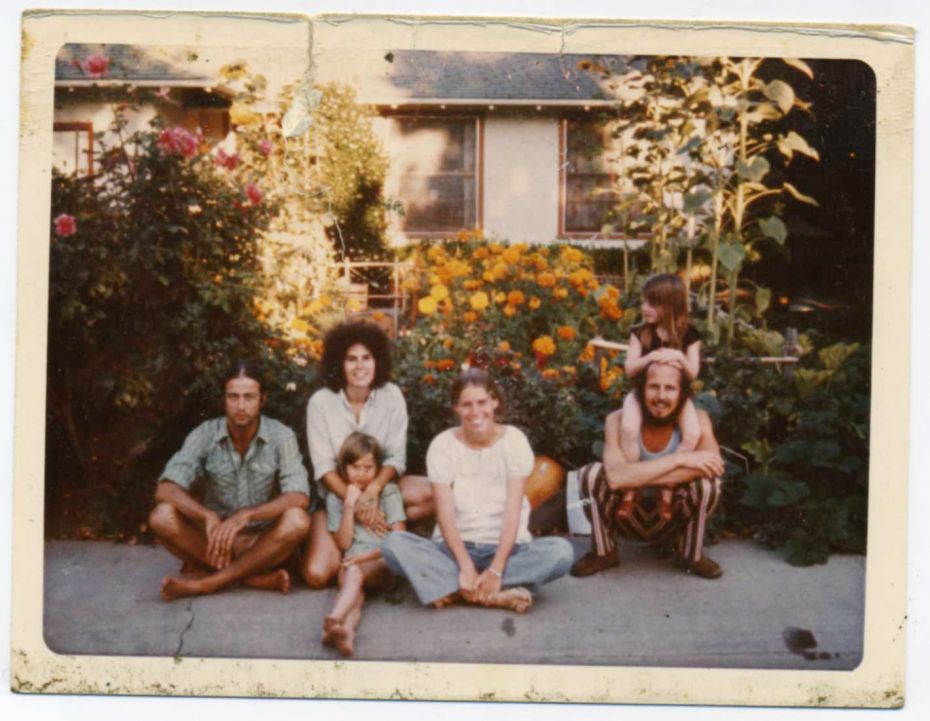 My family, circa 1972: me lounging in my mom’s arms, with her (Shakespeare look-alike) boyfriend carrying my sister on his shoulders, a female friend, and the guy who lived in our garage (far left).