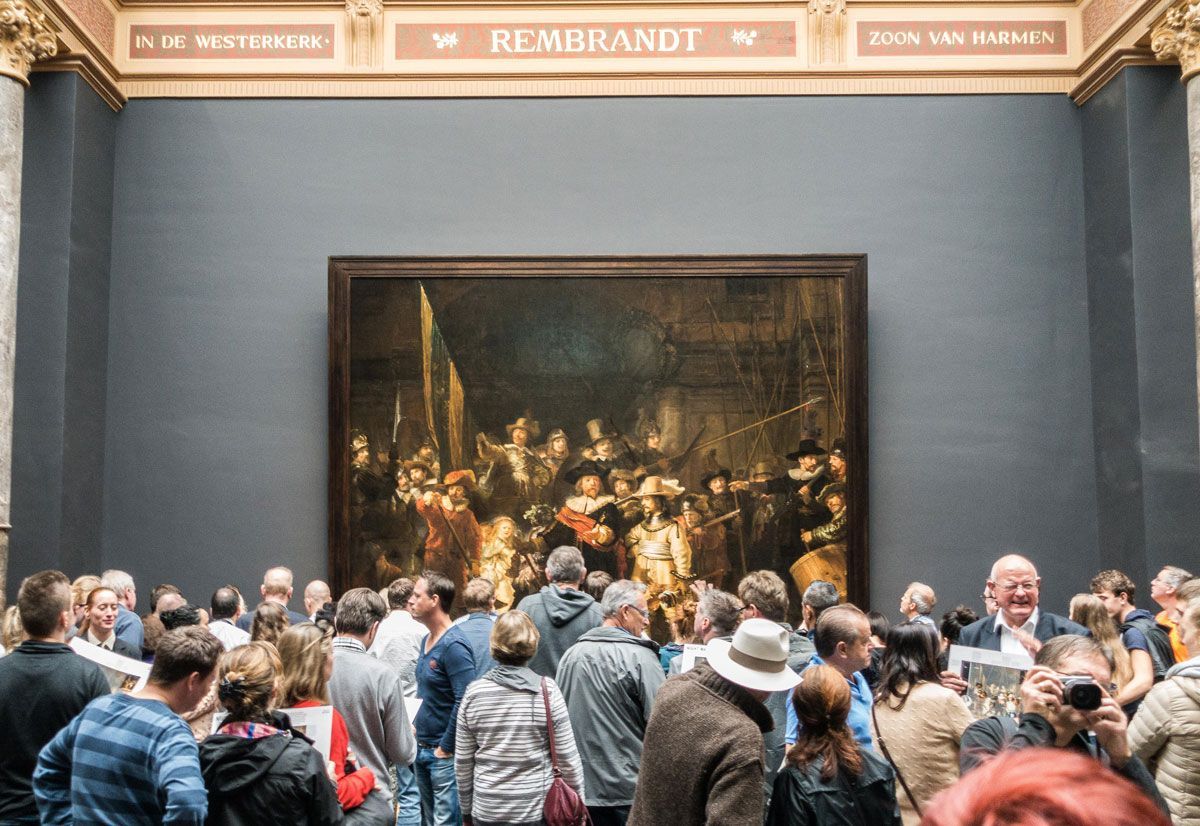 The crowd at Rijksmuseum, surrounding Rembrandt's famous 'Night Watch.'